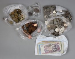 Collection of foreign currency to include silver, brass, copper and notes