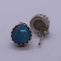 Pair of silver earrings set with blue opal