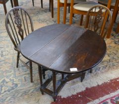 Children’s gate leg table together with pair of elm seated wheel back chairs