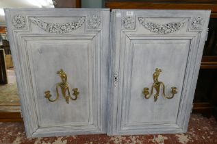 Pair of wooden panels fitted with brass candle sconces