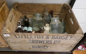 Wooden crate of vintage glass bottles