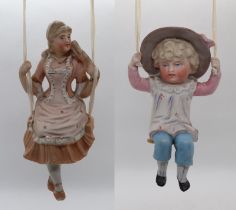 2 ceramic figures on swings - possibly German