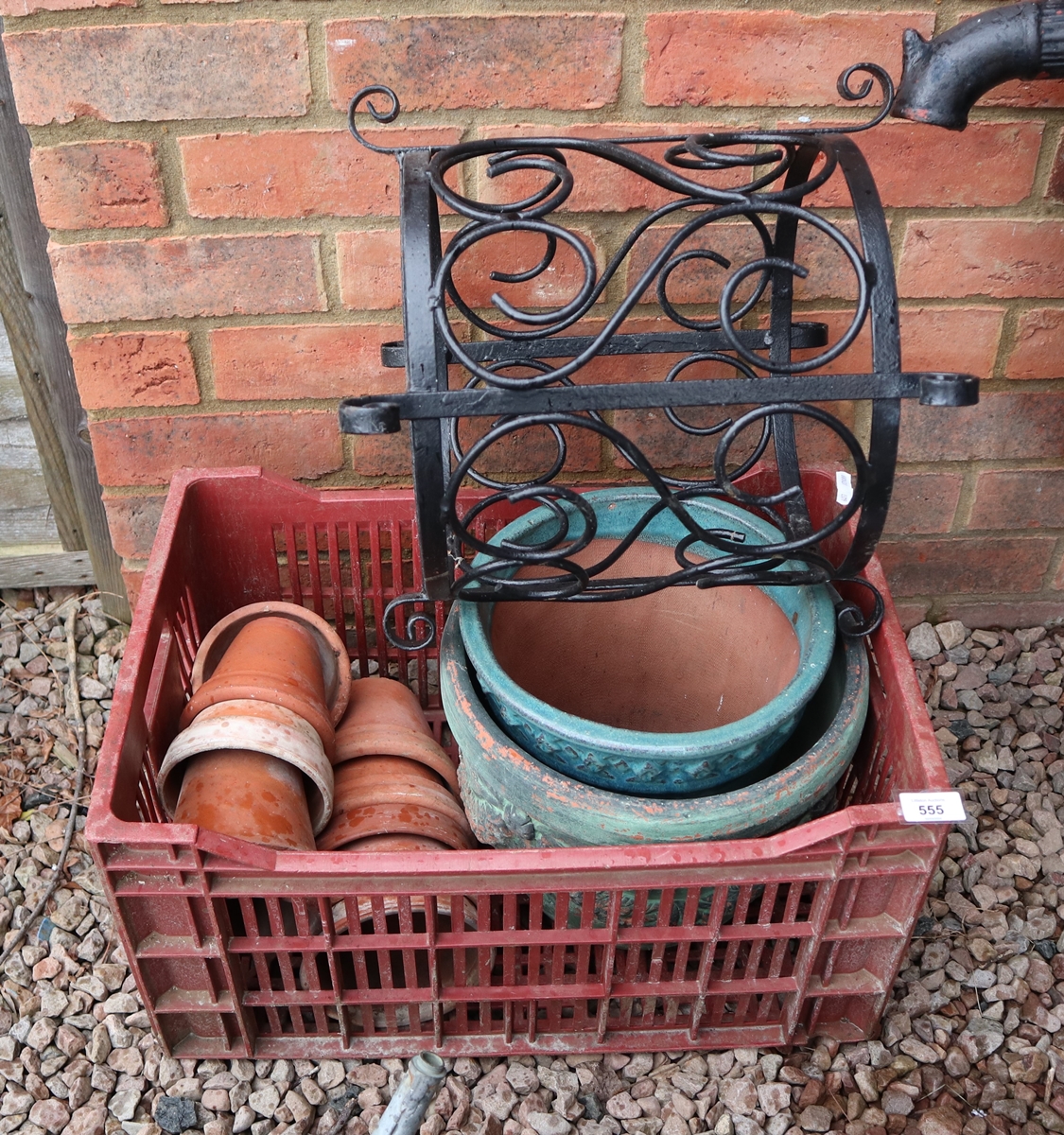 Collection of garden pots together with a metal pot holder