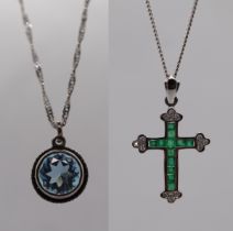 18ct white gold Emerald and diamond crucifix on 18ct white gold chain and a silver pendant on chain