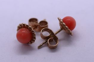 Pair of 9ct gold coral stud earrings