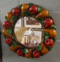 Mirror adorned with apples and pears