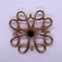 9ct gold brooch set with a sapphire