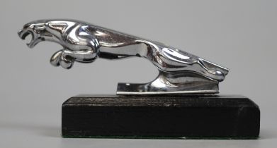 Jaguar car mascot mounted on wooden base