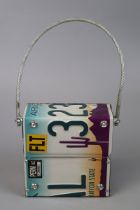 Ladies handbag fashioned from an American license plate