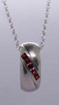 Silver garnet set pendent on chain