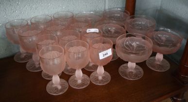 Collection of pink glassware adorned with flowers