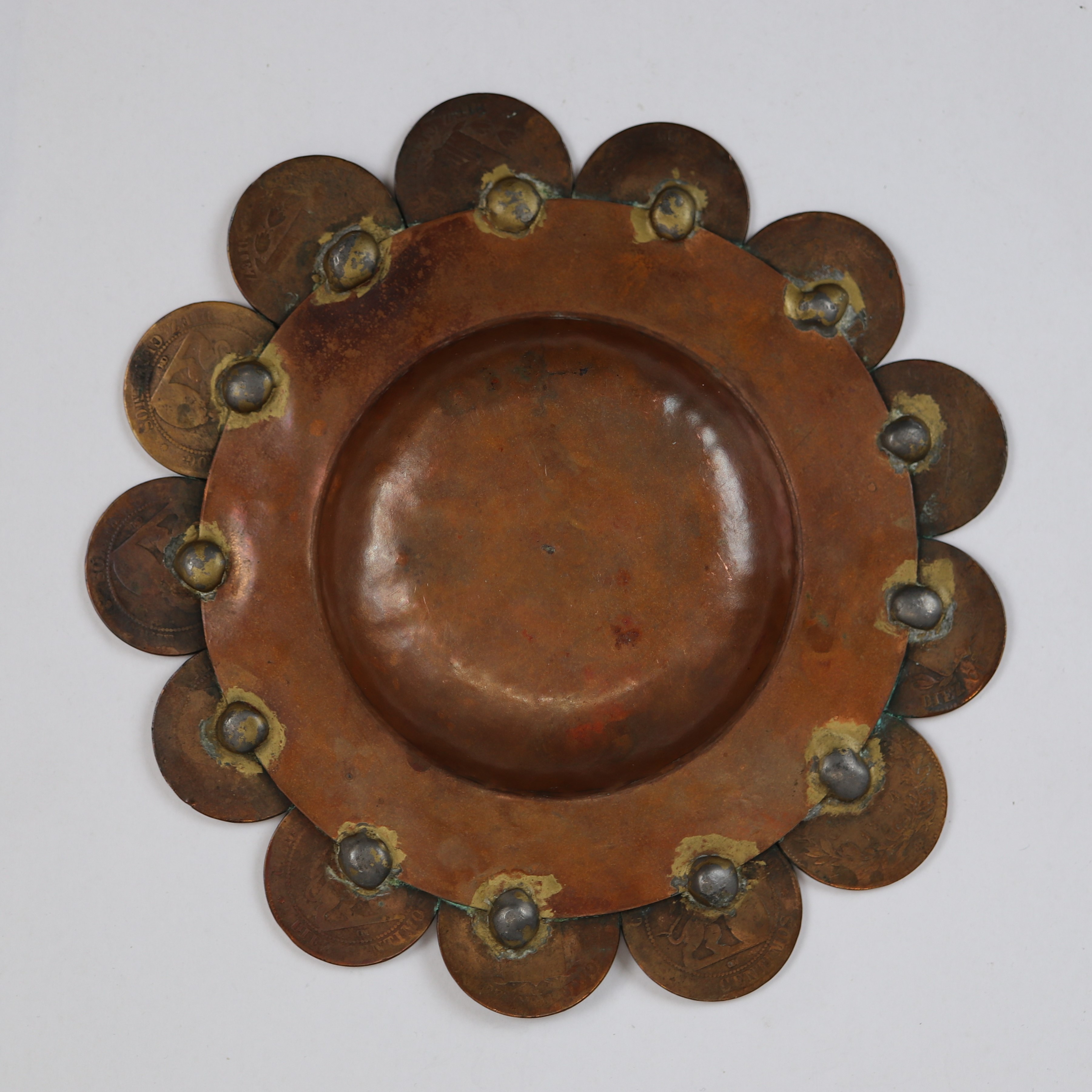 Hand beaten copper pin dish with a ring of integrated coins - Image 2 of 2