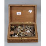 Carved wooden box containing old coins