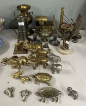 Collection of brass animals, mainly elephants