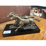 Bronze sculpture of 2 running horses on base