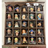 25 miniature Toby jugs in display case