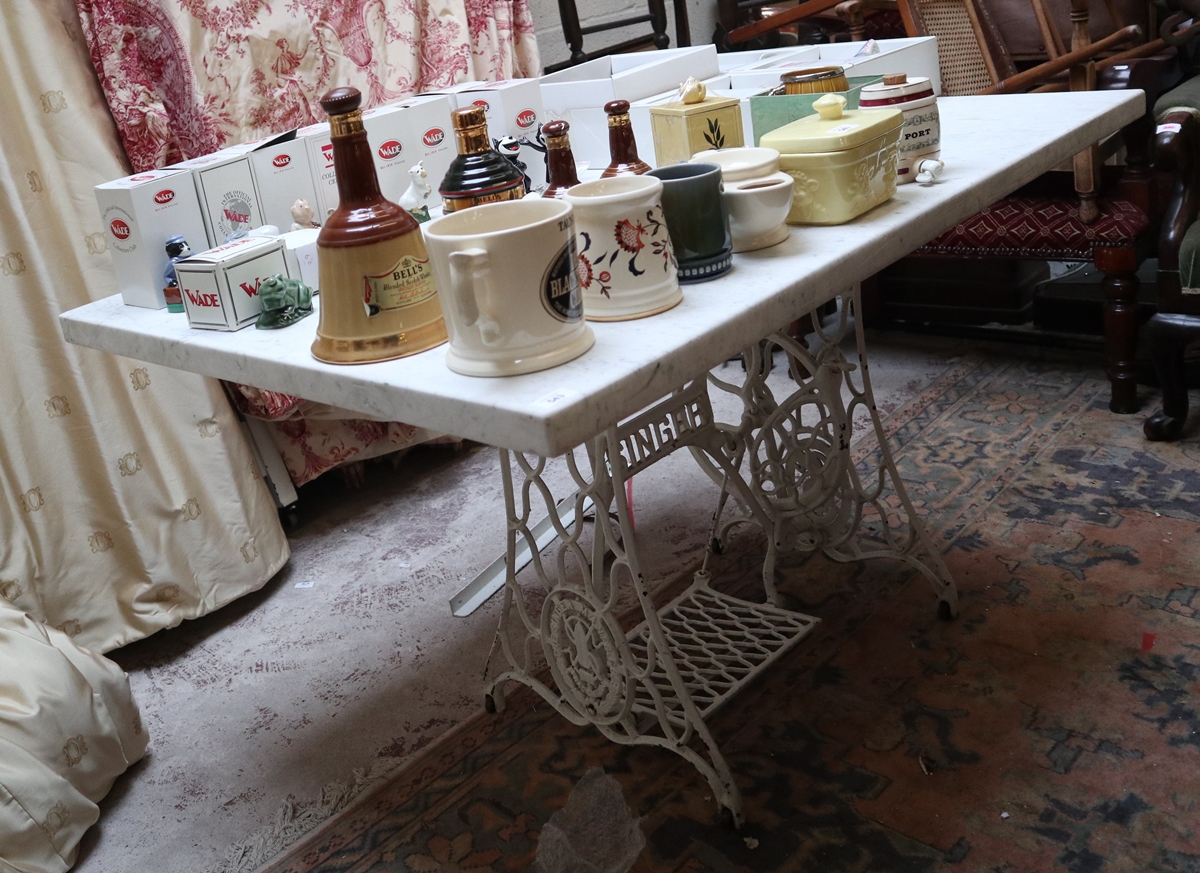 Singer sewing machine base converted to table with marble top