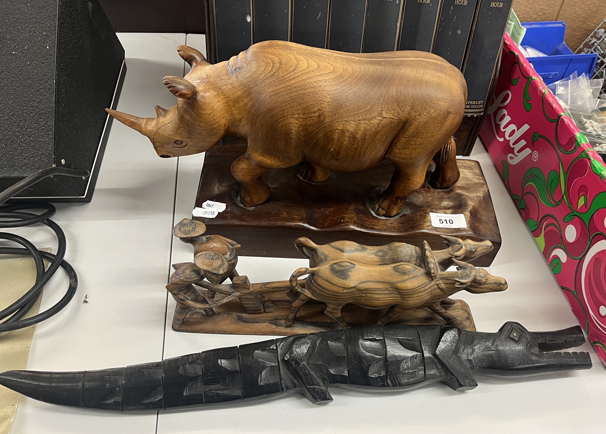 Carved wooden animals to include large rhino