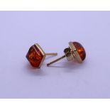 Pair of 9ct gold amber set earrings