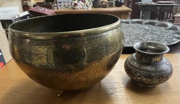 Chinese brass pot on feet together with a smaller brass pot