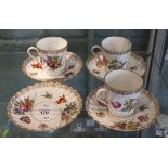 3 Dresden tea cups together with 4 saucers