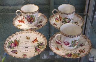 3 Dresden tea cups together with 4 saucers