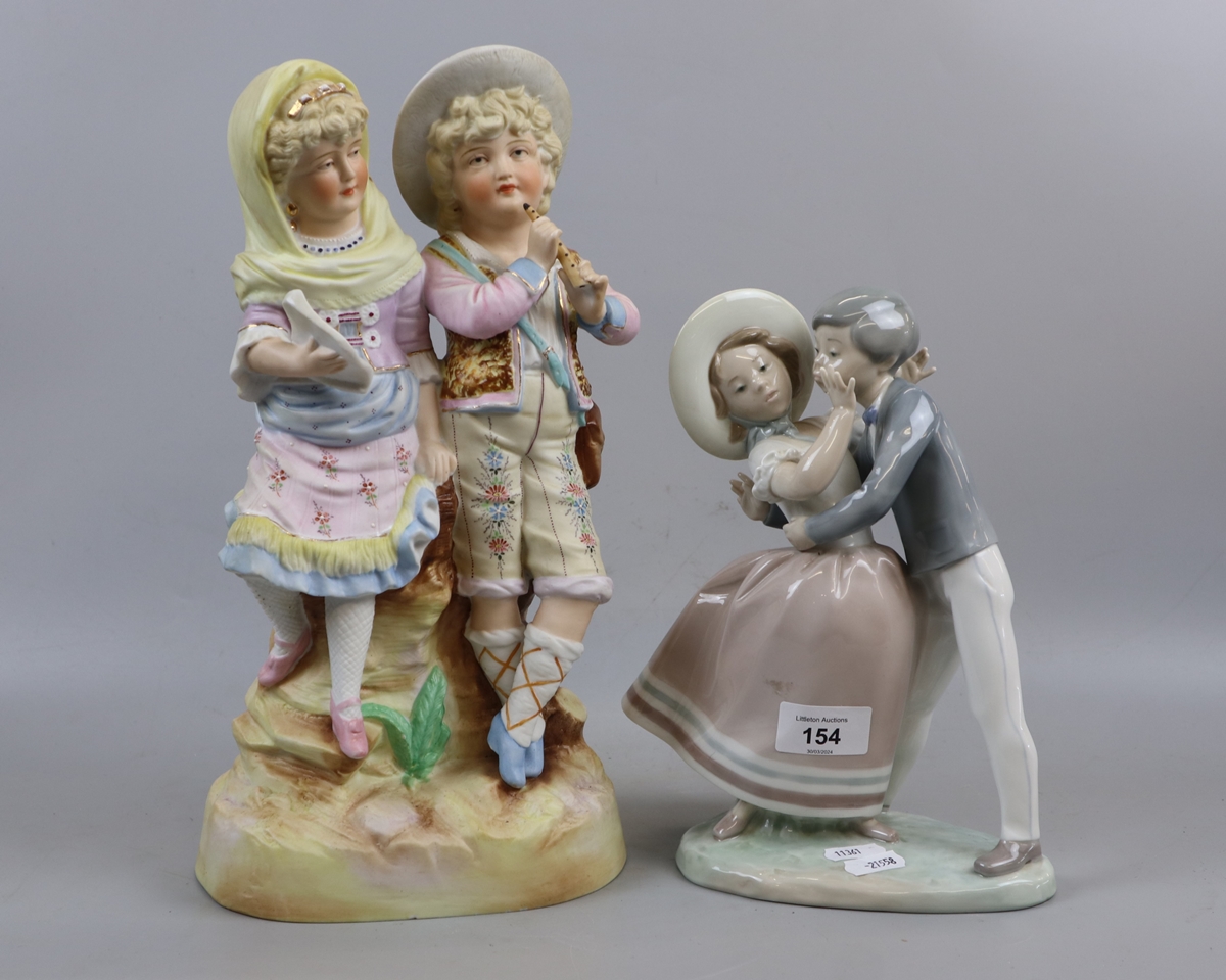 Lladro figure of boy and girl together with Staffordshire style figure of boy and girl