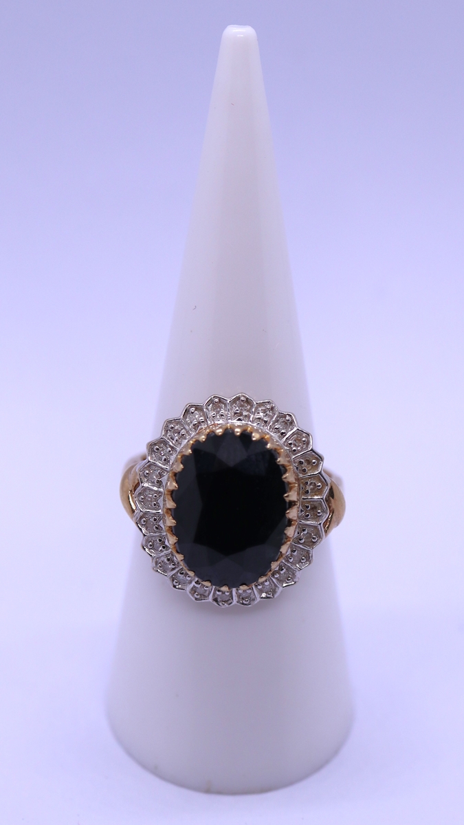 9ct gold ring set with a large sapphire & diamonds - Size M
