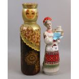 2 Russian figures, one with vodka inside