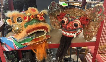 Chinese Lion mask together with a Thai dancing mask