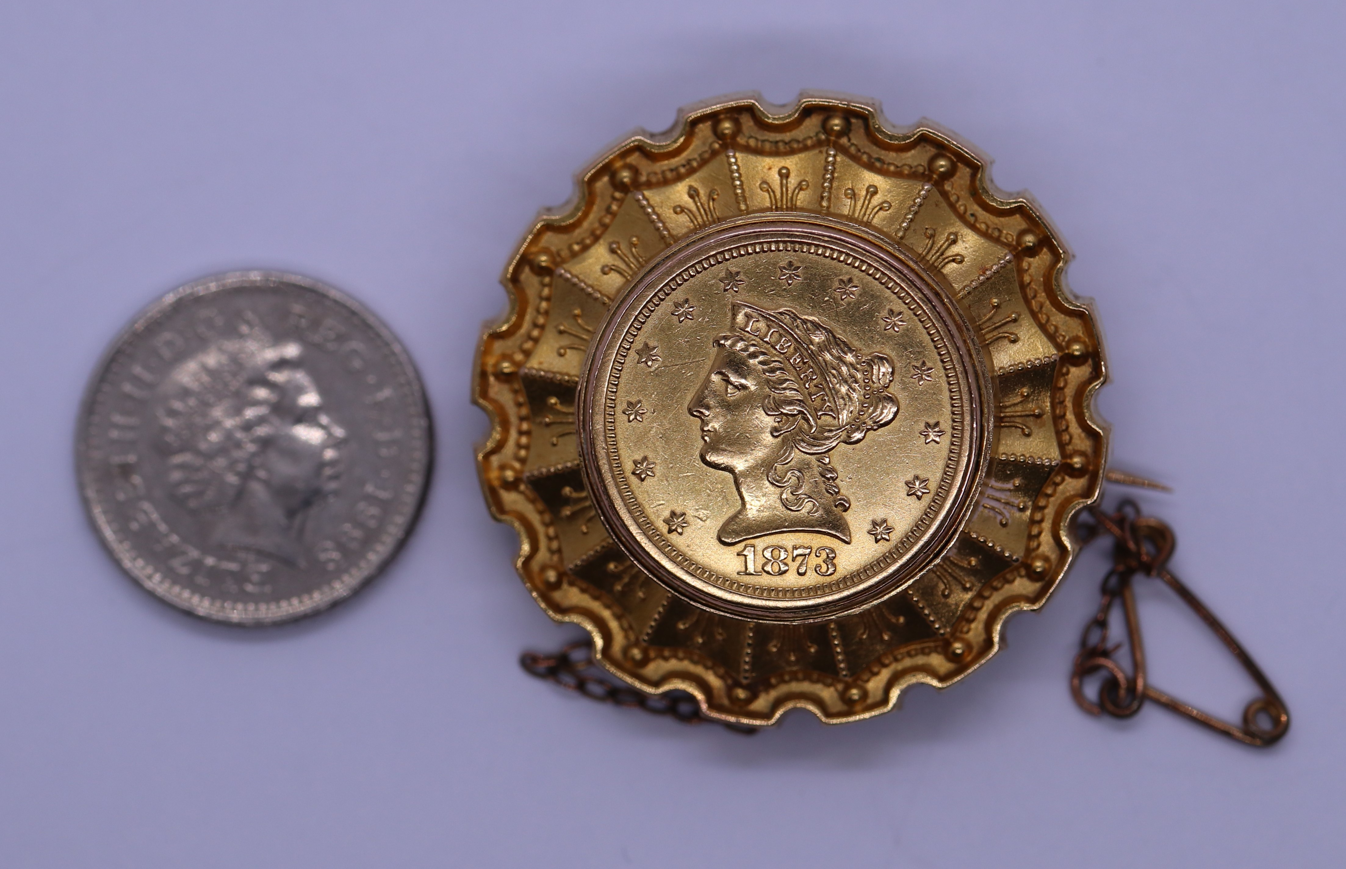 Gold mourning brooch set with a 22ct $2.5 coin dated 1873 - Gross weight 12.2g - Image 2 of 4