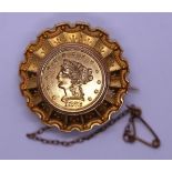 Gold mourning brooch set with a 22ct $2.5 coin dated 1873 - Gross weight 12.2g