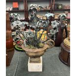 Ornate verdi gris candlesticks in urn
