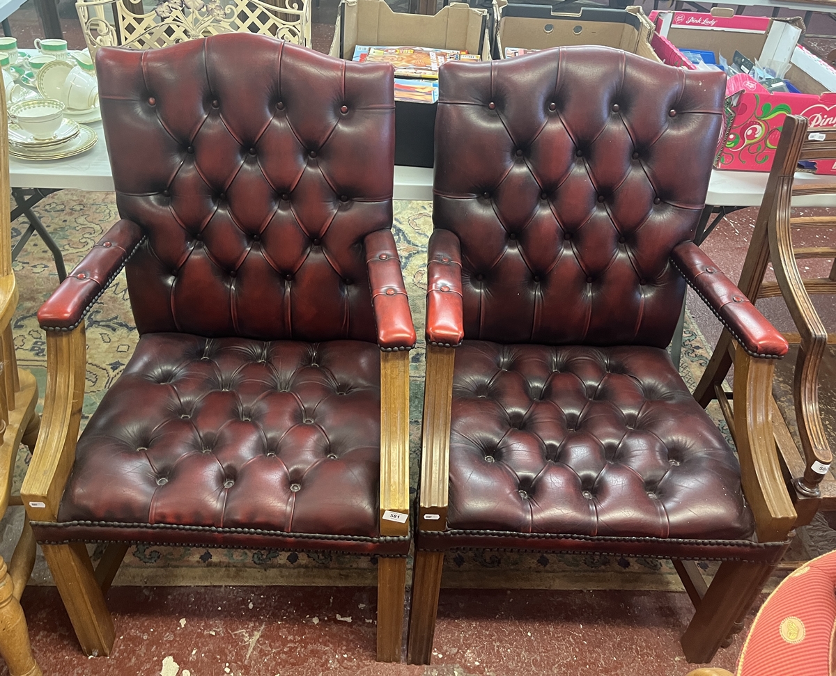 Pair of ox blood leather armchairs