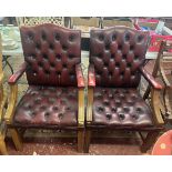 Pair of ox blood leather armchairs