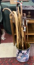 Collection of walking sticks together with a shooting stick