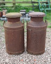 Pair of rusty milk churns