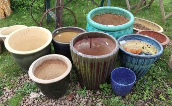 Collection of planters to include glazed examples with feet