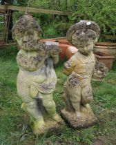 Stone figures of boy and girl