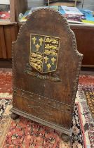 Victorian leather covered fire screen with crest