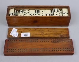 Dominoes set together with cribbage board