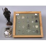Collection of framed and loose military badges and buttons together with a model of a knights armour