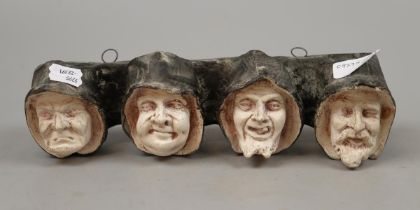 Ceramic pipe rack depicting 4 monks