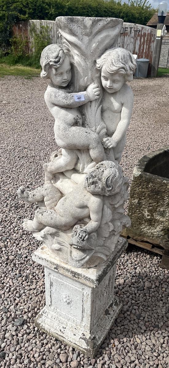 Stone pedestal adorned with cherubs and dolphins on stone base - Approx height: 138cm