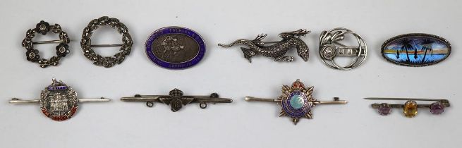 10 silver brooches