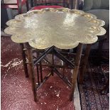 Folding brass topped table with provenance