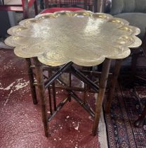 Folding brass topped table with provenance