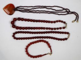 Collection of carnelian jewellery together with a garnet bead necklace with a agate heart pendent