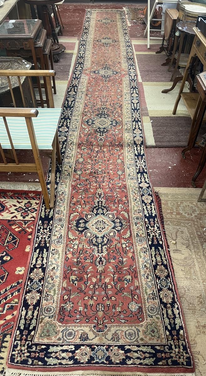 Large red patterned runner - Approx size: 620cm x 78cm