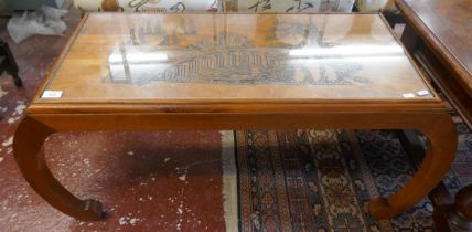 Glass topped Oriental coffee table - Approx size: W: 109cm D: 45cm H: 46cm